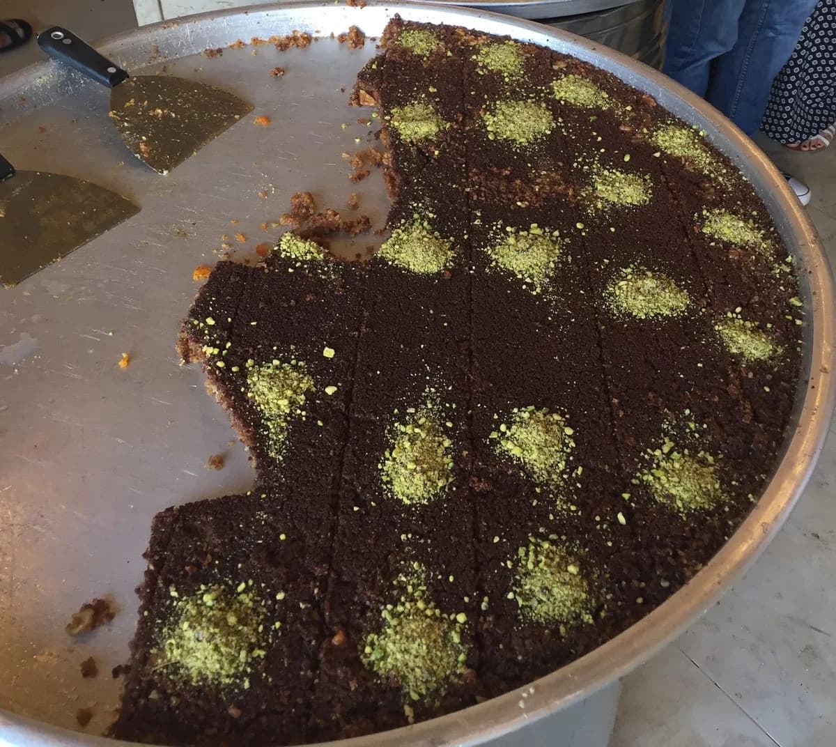 Gazan-style knafeh Arabiyeh made with semolina pastry and a walnut and spice filling.